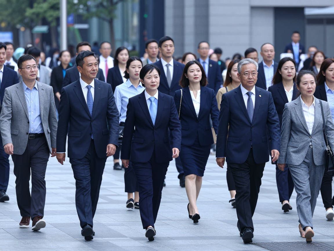 Professionals crossing a busy city street